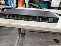 Front panel view showing control knobs, effect buttons, and power button with indicators on the Washburn WD-700 digital delay unit.