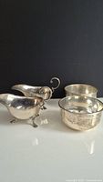 Four piece lot: two sauce boats and two bowls arranged