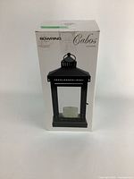 Photo of Bowring Cabos outdoor patio lantern in original box, showing front view