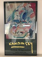 Frontal view of the framed Kandinsky poster showing the artwork and text details clearly.