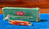 Photo of the CASE knife with original box showing knife closed and box with case logo and branding.