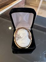 Front view of cameo in black velvet presentation box