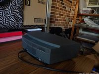 Side rear view of the DX radio showing power cord and ventilation slats