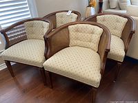 Four chairs grouped together showing overall condition and style