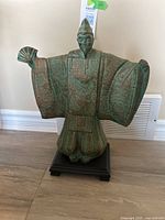 Front view of the vintage Japanese samurai plaster statue highlighting the green bronzed verdigris finish and detailed robe patterns.