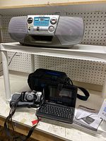 Sony CFD-V7 CD radio cassette-corder on white table, showing front and speakers