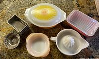 Overhead image of all items showing the full assortment including casserole dish, loaf pans, bundt pan, mixing bowl, and juicer