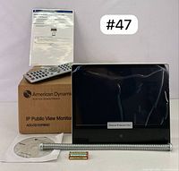 Full lot content including monitor, remote, mounting bracket, software CD, batteries, and user manual.