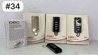 Set of 3 DSC wireless remote controls in packaging with one remote outside boxes and instruction manual included.