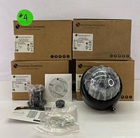 Full lot grouped showing 4 boxes, 1 black dome camera unit with dome cover, mounting accessories, and manual/disc.