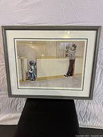 Front view of the professionally framed print titled "Two For Roughing" depicting an ice hockey player and referee.