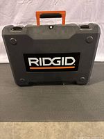 Closed Ridgid hard plastic carrying case for the jig saw.