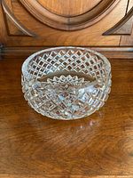 Side view of clear crystal bowl showing the deep diamond cut pattern and thickness.