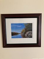 Full view of framed pastel painting hanging on wall
