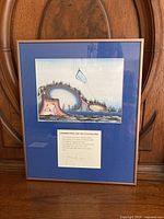 Front view of framed James Mishibimijima print with artwork title and signature visible on matting.