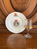 Plate featuring colored crest and portraits of Prince Charles and Lady Diana, gold trim, Queen Anne fine china from England.