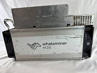 Front and side view showing the main unit with Whatsminer branding and model M21S.