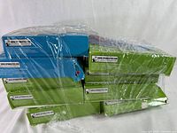 Stacked and shrink-wrapped nine puzzle boxes showing side and top of boxes with Cardinal labels and 500 piece count.