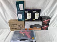 Full lot showing all major items together including gaming mice, led pond lights, smart switches, power supply and plastic welding tool.