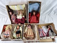 Overview of all 6 dolls in boxes, demonstrating assortment and condition