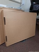 Brown shipping box likely containing the monitor.