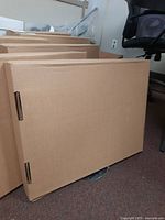 Sealed cardboard box packaging for the monitor.