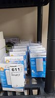 Shelf display of multiple boxed Lutron Caseta LED+ and Wireless dimmers