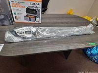 Driver in packaging on table