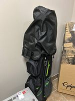 Full view of black TaylorMade golf bag with top cover