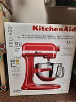 Front of original white box showing red KitchenAid Pro 600 stand mixer, model name and 5.7 L capacity