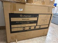 Front of sealed cardboard box showing Lifesmart logo, model number R5J01LGBK and marketing text.