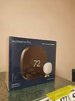 Front of one Ecobee for Pro Smart Thermostat Premium box, sealed in original plastic.