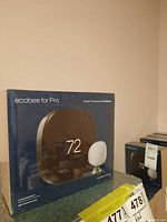 Front of a sealed Ecobee for Pro Smart Thermostat Premium box showing branding and SmartSensor image