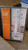 Box of 5 light floor lamp featuring an image of the assembled lamp with five white shades and flexible gooseneck arms on a silver metal stand.