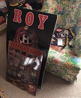 Two large Montreal Canadiens themed poster boards visible. One is a detailed Stanley Cup Champions poster from 1893 to 1918 showing black and white team photos. The other is a bold ROY board with Canadiens helmet.