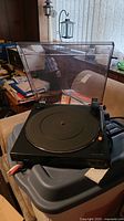 Photo of Toshiba SR 3617 turntable with dust cover open, showing rubber mat and tonearm.