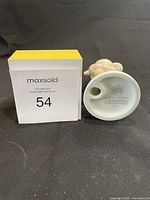 Bottom and back view showing base markings with title and date and block box with lot number