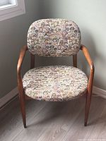 Front view of the walnut frame and cushions