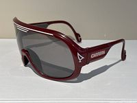 Angled side and front view of dark red Carrera Racer sunglasses showing frame and lens condition.
