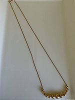 full view of necklace showing chain and bead arrangement