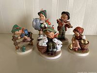 Front view of all five figurines together