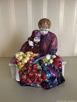 Front view showing two children seated on a white bench with basket of colorful roses