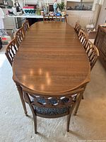 Extended oval table with eight chairs around