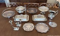 Photo of full lot on table showing all pieces including trays, serving dishes, candle holders and decorative items.