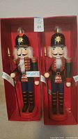 Pair of Holiday Lane wooden nutcrackers in original red box.