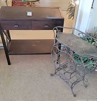 Photo showing the metal wine rack and the black 2 drawer hall table together, displaying condition and overall look.