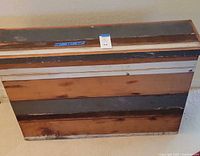 Wooden picture crate viewed from top side showing distressed finish and lid