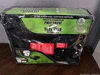 Front view of Slime Flat Tire Repair Kit packaging showing brand and repair duration