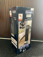 Box front showing product image and key power info 1500 watts, ceramic heater, oscillating function.