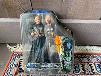 Two horror-themed Barbie figurines in sealed original packaging.